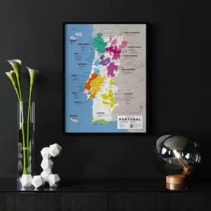 Framed map of Portugal's wine regions displayed on a dark wall.