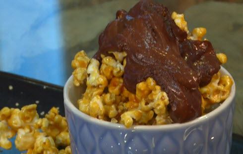 A bowl of popcorn with banana ice cream.