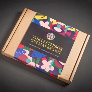 Closed cardboard box with colourful branding labelled 'The Letterbox Gin Maker's Kit.