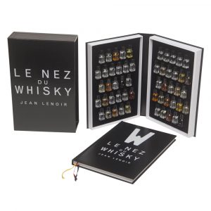 Le Nez du Whisky kit by Jean Lenoir, featuring an open book with vials of various whiskey aromas.