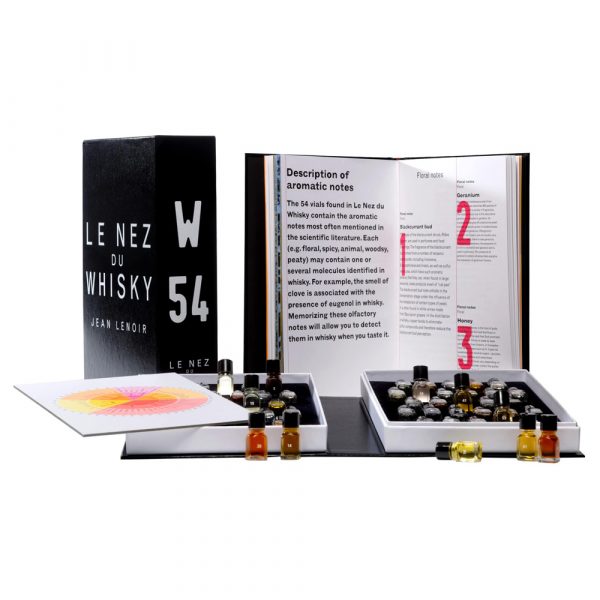 Le Nez du Whisky kit by Jean Lenoir displayed open, showing 54 aromatic vials, an information booklet, and a tasting guide.