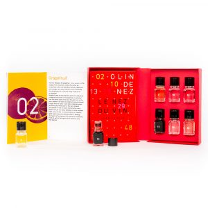 Open red box showing vials of aromatic extracts with a reference booklet, part of Le Nez Du Vin, The Nose Knows 6 Aroma Training Kit by Jean Lenoir.