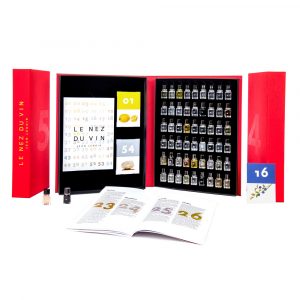 Le Nez du Vin, wine master aroma kit with vials, booklet, and reference cards in an open red box.