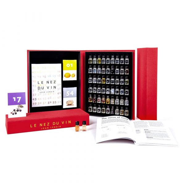 Le Nez du Vin, wine master aroma kit with vials, booklet, and reference cards in an open red box.