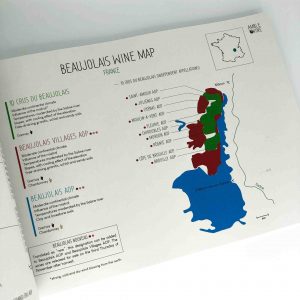 Open book showing a wine map of the Beaujolais region in France.