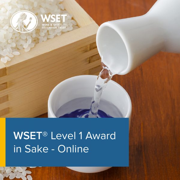 Someone pouring a cup of Sake this o wooden box of rice in the background with a blue title box in the bottom left corner saying "WSET Level 1 Award in Sake - Online".