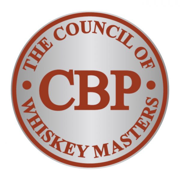 A round silver-coloured badge with red text reading "The Council of Whiskey Masters" around the outer edge and "CBP" prominently displayed in the centre.